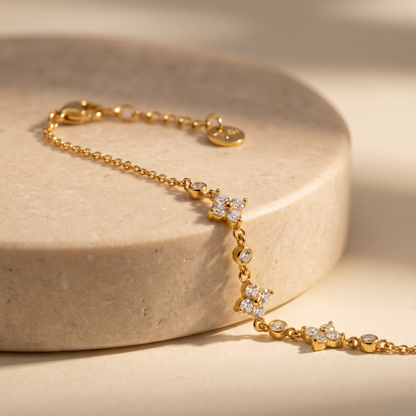 Juniper Clover Cluster Bracelet displayed on travertine